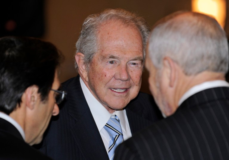 Rev. Pat Robertson, center, talks to attendees at a prayer breakfast, Jan. 16, 2010, in Richmond, Va. 