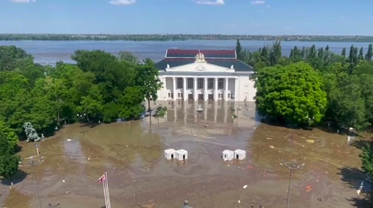 In this handout photo taken from a video released by Russian-controlled administration of Kherson Region on Wednesday, June 7, 2023, the central square of Nova Kakhovka is flooded after the Kakhovka dam was blown up, in the Russian-controlled part of the Kherson Region, Ukraine. 