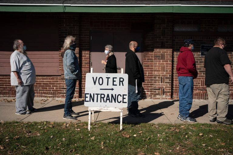 In this Nov. 3, 2020, file photo, voters wait in line outside a polling center on Election Day, in Kenosha, Wisconsin. The state's top elections official is nearing the end of her term, and uncertainty looms over who will hold the position through the 2024 presidential election.