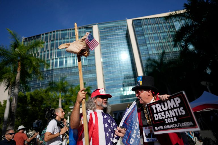 Osmany Estrada and Gregg Donovan, rally outside the Wilkie D. Ferguson Jr. U.S. Courthouse, Tuesday, June 13, 2023, in Miami. Former President Donald Trump is making a federal court appearance today on dozens of felony charges accusing him of illegally hoarding classified documents and thwarting the Justice Department's efforts to get the records back. 