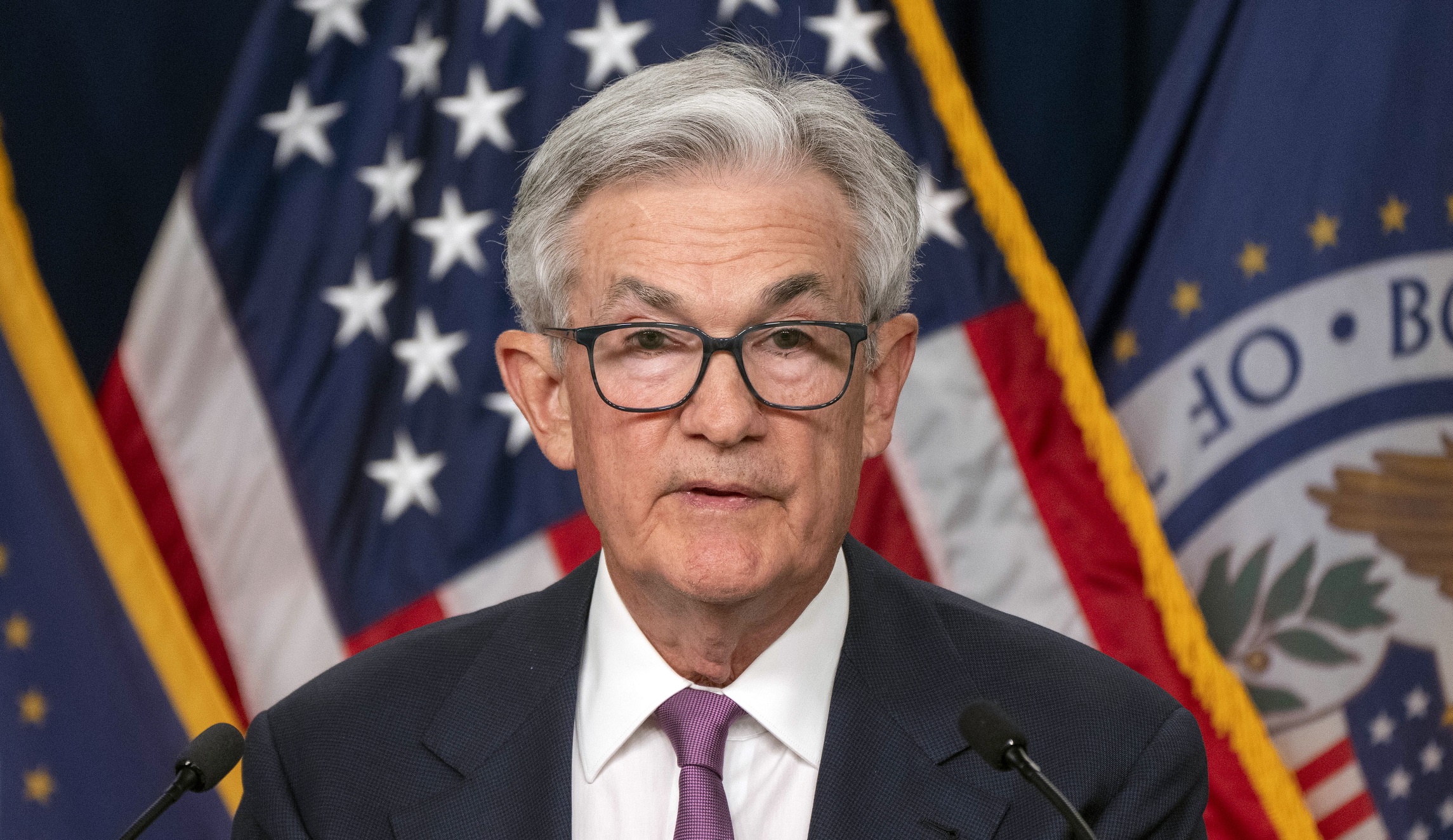 Federal Reserve pauses but projects two more rate hikes this year