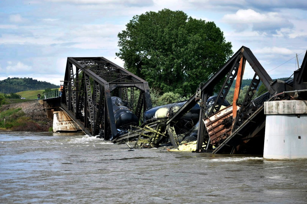 Derailed train on collapsed bridge contaminates Yellowstone River