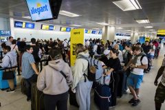 Flight delays and cancellations stack up ahead of holiday weekend travel