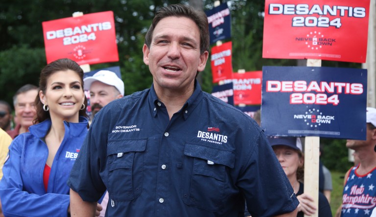 Republican presidential candidate and Florida Gov. Ron DeSantis and his wife Casey, walk in the July 4th parade, July 4, 2023, in Merrimack, N.H.
