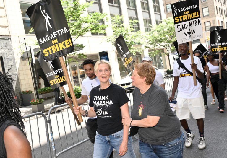 Actor Cynthia Nixon, left, and Christine Marinoni appear on the picket line outside Netflix on Friday, July 21, 2023, in New York. (Photo by Evan Agostini/Invision/AP)