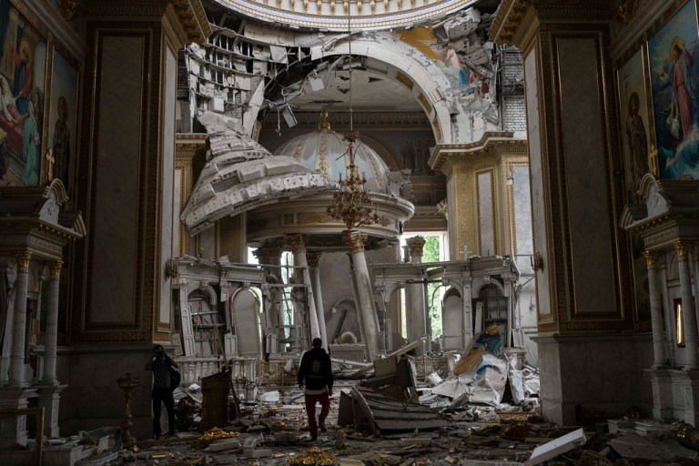 Church personnel inspect damages inside the Odesa Transfiguration Cathedral in Odesa, Ukraine, Sunday, July 23, 2023, following Russian missile attacks.