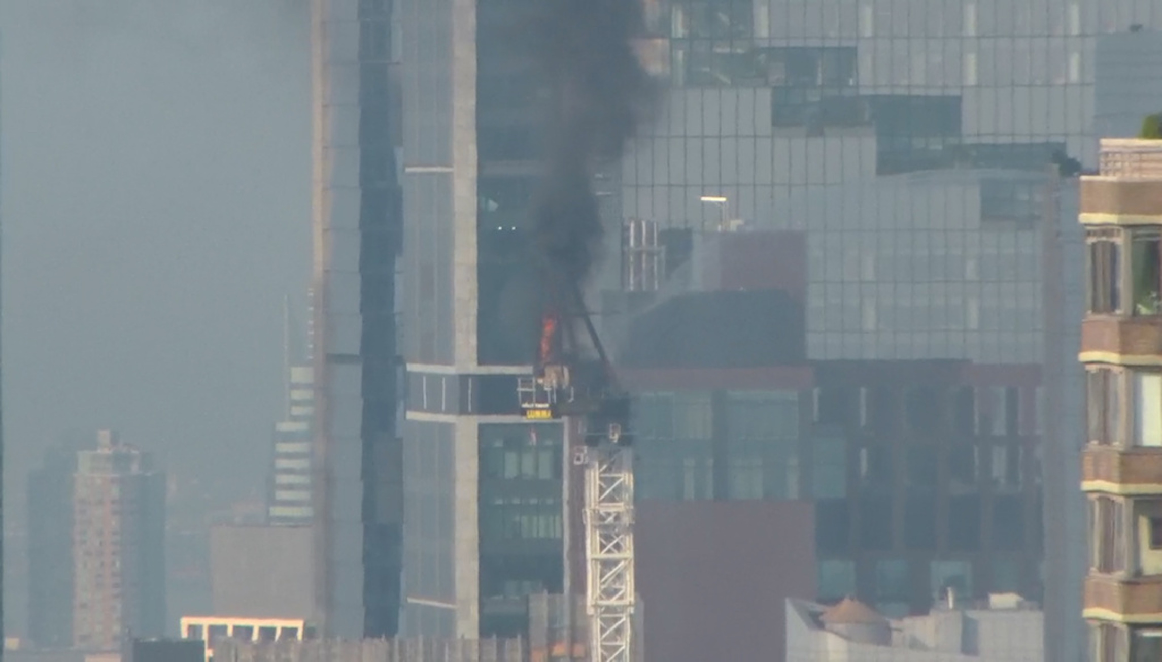 New York City crane collapse: Construction equipment tumbles to ground as it is engulfed in flames