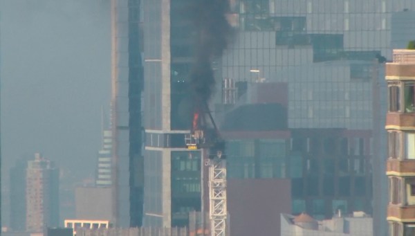 New York City crane collapse: Construction equipment tumbles to ground as it is engulfed in flames