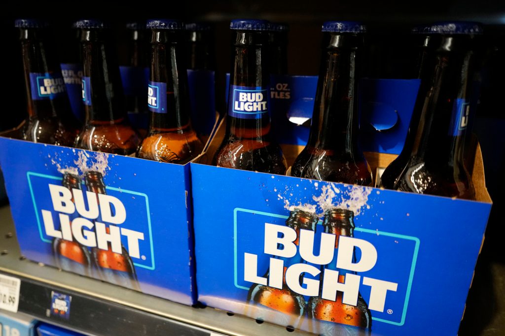 Bud Light owner’s revenue drops by almost $400 million following backlash