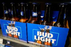Bud Light owner’s revenue drops by almost $400 million following backlash