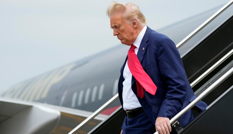 Former President Donald Trump arrives at Ronald Reagan Washington National Airport, Thursday, Aug. 3, 2023, in Arlington, Va., as he heads to Washington to face a judge on federal conspiracy charges alleging Trump conspired to subvert the 2020 election. 