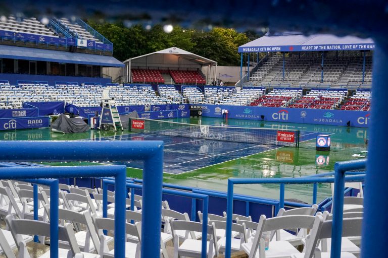 The stadium is empty as rain falls to delay the the men's singles final of the DC Open tennis tournament between Daniel Evans, of Britain, and Tallon Griekspoor, of the Netherlands, Sunday, Aug. 6, 2023, in Washington. 