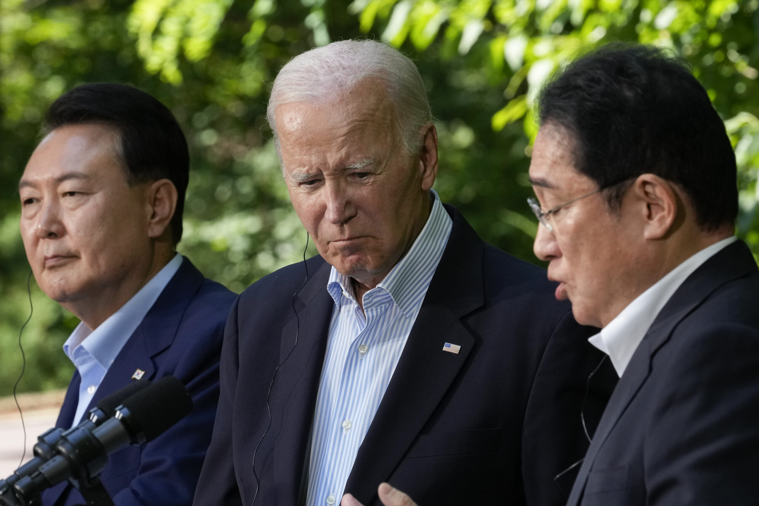 Biden chides Trump’s ‘America First’ foreign policy at Camp David trilateral