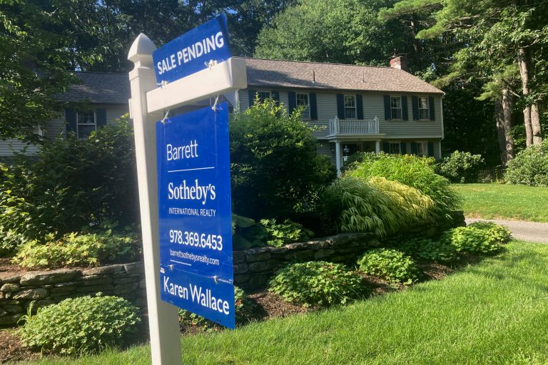 A sign noting a pending sale is shown in front of a home on Sunday, Aug. 20, 2023, in Concord, Massachusetts. On Thursday, Oct. 19, 2023, the National Association of Realtors reported sales of existing homes fell in September.
