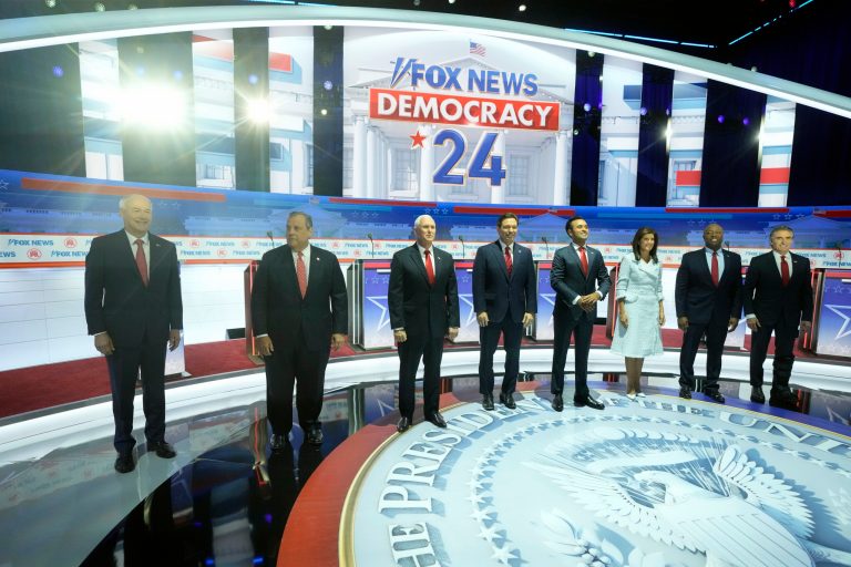 Republican presidential candidates, from left, former Arkansas Gov. Asa Hutchinson, former New Jersey Gov. Chris Christie, former Vice President Mike Pence, Florida Gov. Ron DeSantis, businessman Vivek Ramaswamy, former U.S. Ambassador to the United Nations Nikki Haley, Sen. Tim Scott (R-SC), and Gov. Doug Burgum (R-ND) stand onstage before a Republican presidential primary debate hosted by Fox News on Wednesday, Aug. 23, 2023, in Milwaukee.