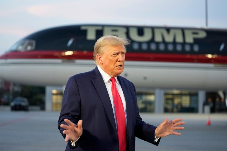 Former President Donald Trump speaks with reporters before departure from Hartsfield-Jackson Atlanta International Airport, Thursday, Aug. 24, 2023, in Atlanta. 