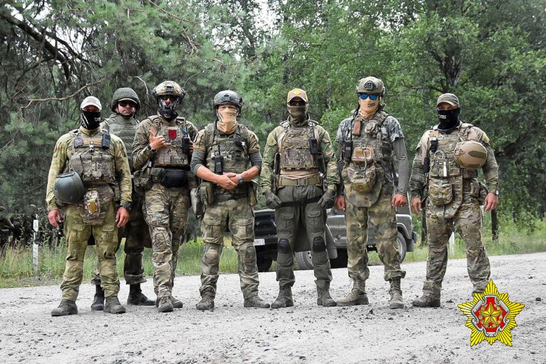 FILE - In this photo released by Belarus' Defense Ministry on Thursday, July 20, 2023, Belarusian soldiers of the Special Operations Forces (SOF) and mercenary fighters from Wagner private military company pose for a photo while the weeklong maneuvers that will be conducted at a firing range near the border city of Brest, Belarus. (Belarus' Defense Ministry via AP, File)