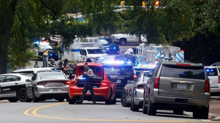 Law enforcement and first responders gather on South Street near the Bell Tower on the University of North Carolina at Chapel Hill campus in Chapel Hill, N.C., Monday, Aug. 28, 2023, after a report of an 