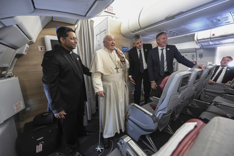 Pope Francis talks to reporters during the return flight from Ulaanbaatar, Mongolia, Monday, Sept. 4, 2023, at the end of a historic four-day visit to a region where the Holy See has long sought to make inroads. 