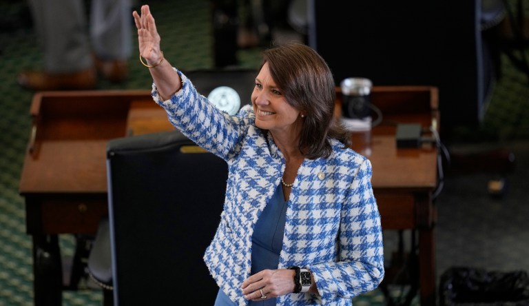 State Sen. Angela Paxton, a Republican, waves and blows kisses in the direction of the gallery before the impeachment trial for Texas Attorney General Ken Paxton, her husband, resumes in the Senate Chamber at the Texas Capitol, Wednesday, Sept. 6, 2023, in Austin, Texas. 
