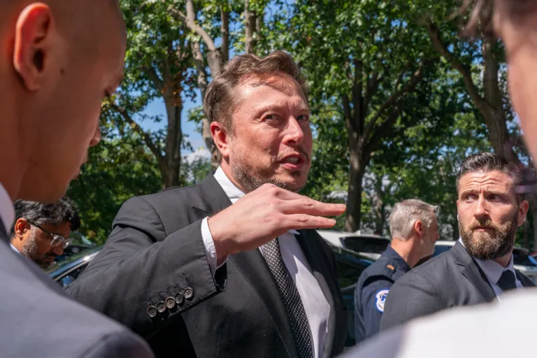 Elon Musk speaks to the media after attending a closed-door gathering of leading tech CEOs on Capitol Hill, Wednesday, Sept. 13, 2023.