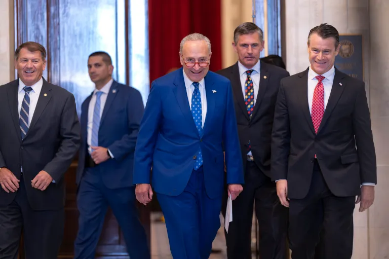 Senate Majority Leader Chuck Schumer (D-NY), center, walks with, from left, Sen. Mike Rounds (R-SD), Sen. Martin Heinrich (D-NM), and Sen. Todd Young (R-IN) during a break at a gathering with leading tech CEOs discussing the priorities and risks of artificial intelligence and how it should be regulated at the Capitol in Washington on Wednesday, Sept. 13, 2023.