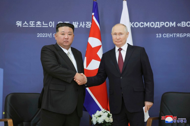 In this photo provided by the North Korean government, North Korean leader Kim Jong Un, left, and Russian President Vladimir Putin shake hands as they pose for a photo before their talk at the Vostochny Cosmodrome outside the city of Tsiolkovsky, about 125 miles from the city of Blagoveshchensk in the far eastern Amur region, Russia, Wednesday, Sept. 13, 2023.
