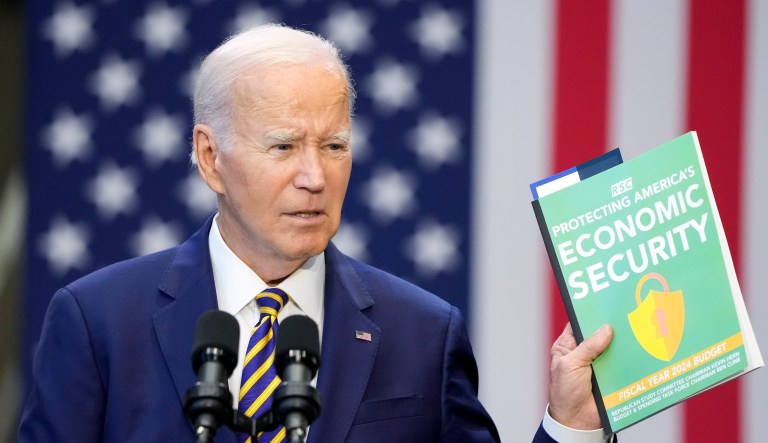 President Joe Biden holds a copy of the Republican Study Committee'sÂ fiscal 2024 budget proposal as he speaks about his administration's economic agenda during an event at Prince George's Community College in Largo, Maryland, Thursday, Sept. 14, 2023.