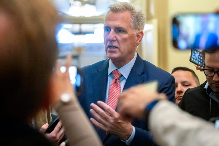 Speaker of the House Kevin McCarthy (R-CA) is surrounded by reporters looking for updates on plans to fund the government and avert a shutdown at the Capitol in Washington on Friday, Sept. 22, 2023.