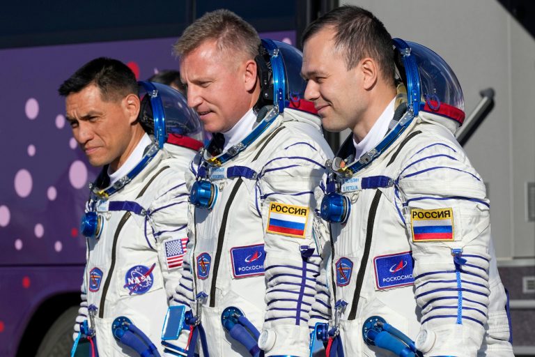 FILE - From left, NASA astronaut Frank Rubio, Roscosmos cosmonauts Sergey Prokopyev and Dmitri Petelin, crew members of the mission to the International Space Station, walk to the rocket prior to the launch of Soyuz-2.1 rocket, at the Russian leased Baikonur cosmodrome, Kazakhstan, Wednesday, Sept. 21, 2022. The three are expected to return to Earth on Wednesday, Sept. 27, 2023, after being stuck in space for just over a year after their original capsule was hit by space junk. The 180-day mission turned into a 371-day stay.