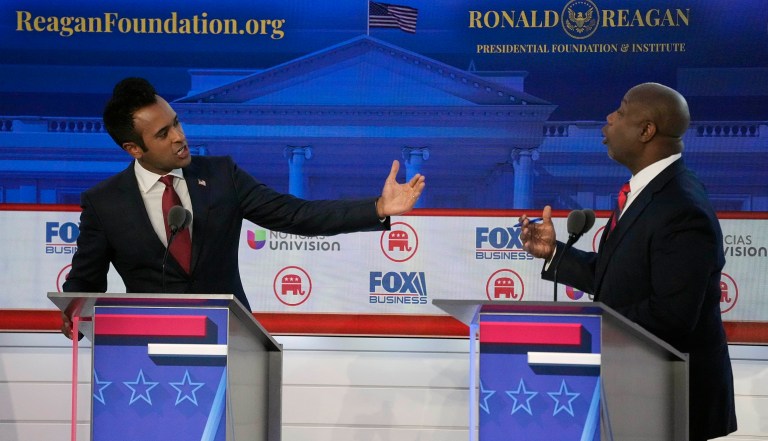 Businessman Vivek Ramaswamy, left, argues a point with Sen. Tim Scott (R-SC) during a Republican presidential primary debate hosted by Fox Business Network and Univision, Wednesday, Sept. 27, 2023, at the Ronald Reagan Presidential Library in Simi Valley, California.