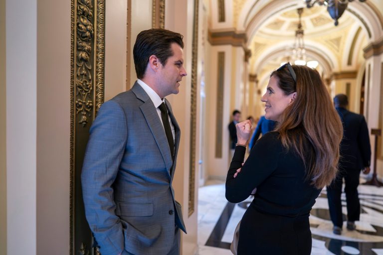Rep. Matt Gaetz (R-FL) and Rep. Nancy Mace (R-SC), right, confer in the hallway near the House chamber just after a stopgap spending bill advanced on a procedural vote but with final passage uncertain at the Capitol in Washington, Friday, Sept. 29, 2023.