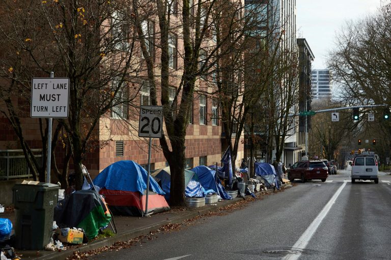Tents line the sidewalk on SW Clay Street in Portland, Oregon, on Dec. 9, 2020. A group of people experiencing homelessness in Portland filed a class action lawsuit on Friday, Sept. 29, 2023, challenging the cityâs new homeless camping restrictions.