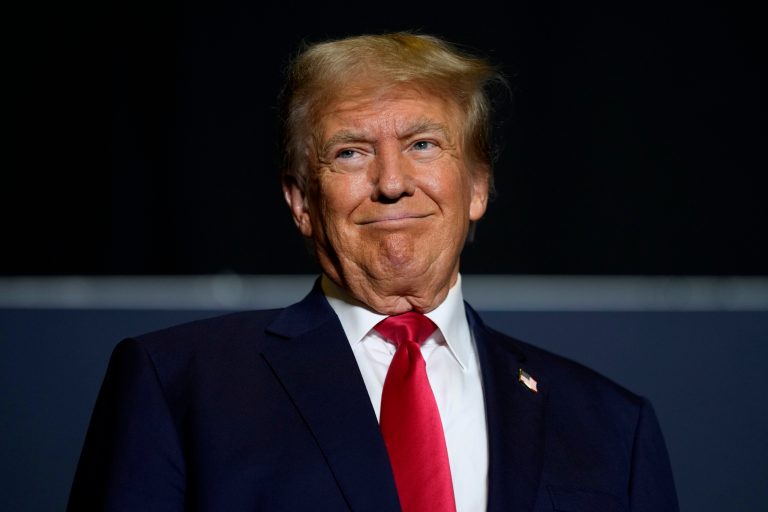 Former President Donald Trump arrives at a commit to caucus rally, Sunday, Oct. 1, 2023, in Ottumwa, Iowa.
