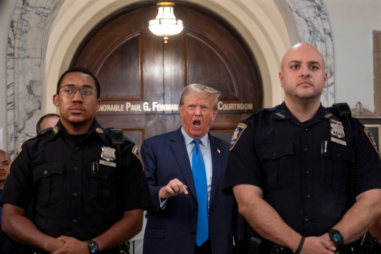 Former President Donald Trump speaks with journalists during a midday break from court proceedings in New York, Monday, Oct. 2, 2023, as he attends the start of a civil trial.