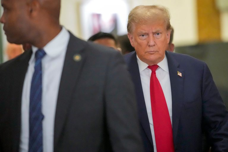 Former President Donald Trump leaves the courtroom during a lunch break in his civil business fraud trial, Wednesday, Oct. 4, 2023, in New York.