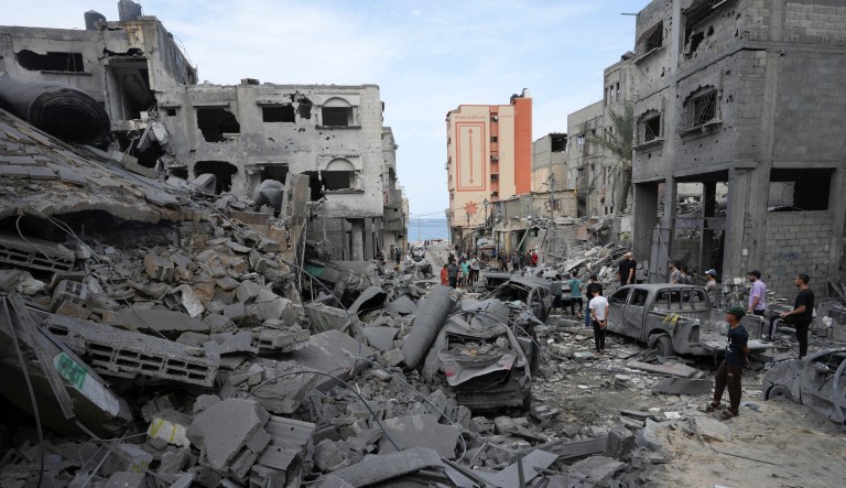 Palestinians inspect the rubble of the west mosque destroyed after it was hit by an Israeli airstrike in Gaza City early on Monday.