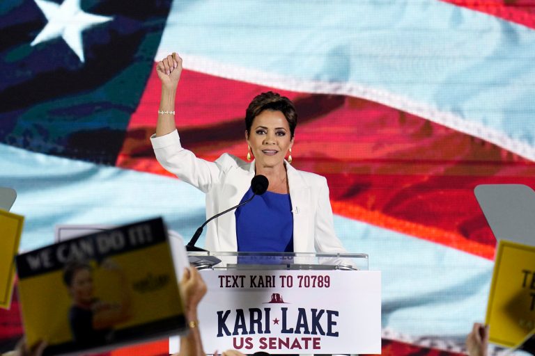 Republican candidate Kari Lake waves to supporters as she announces her plans to run for the Arizona U.S. Senate seat during a rally Tuesday, Oct. 10, 2023, in Scottsdale, Arizona.