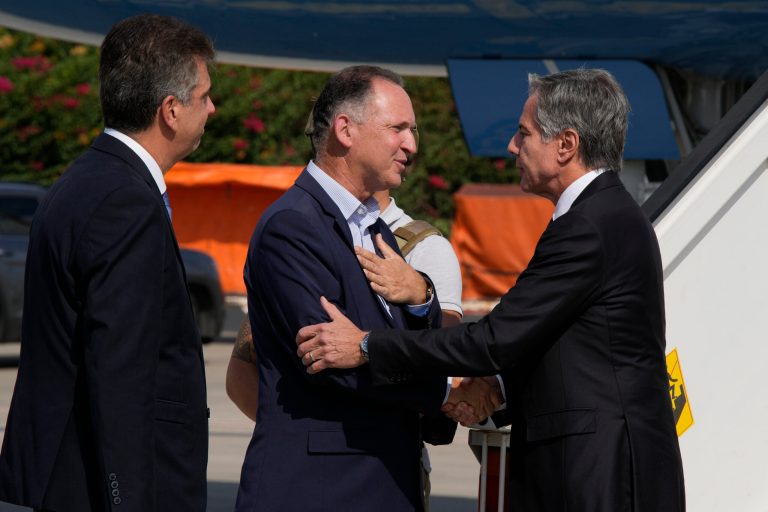 Chief of MFA Protocol Gil Haskel, center, and Israel's Foreign Minister Eli Cohen, left, welcome, Secretary of State Antony Blinken in Tel Aviv, Israel, Thursday Oct. 12, 2023. 