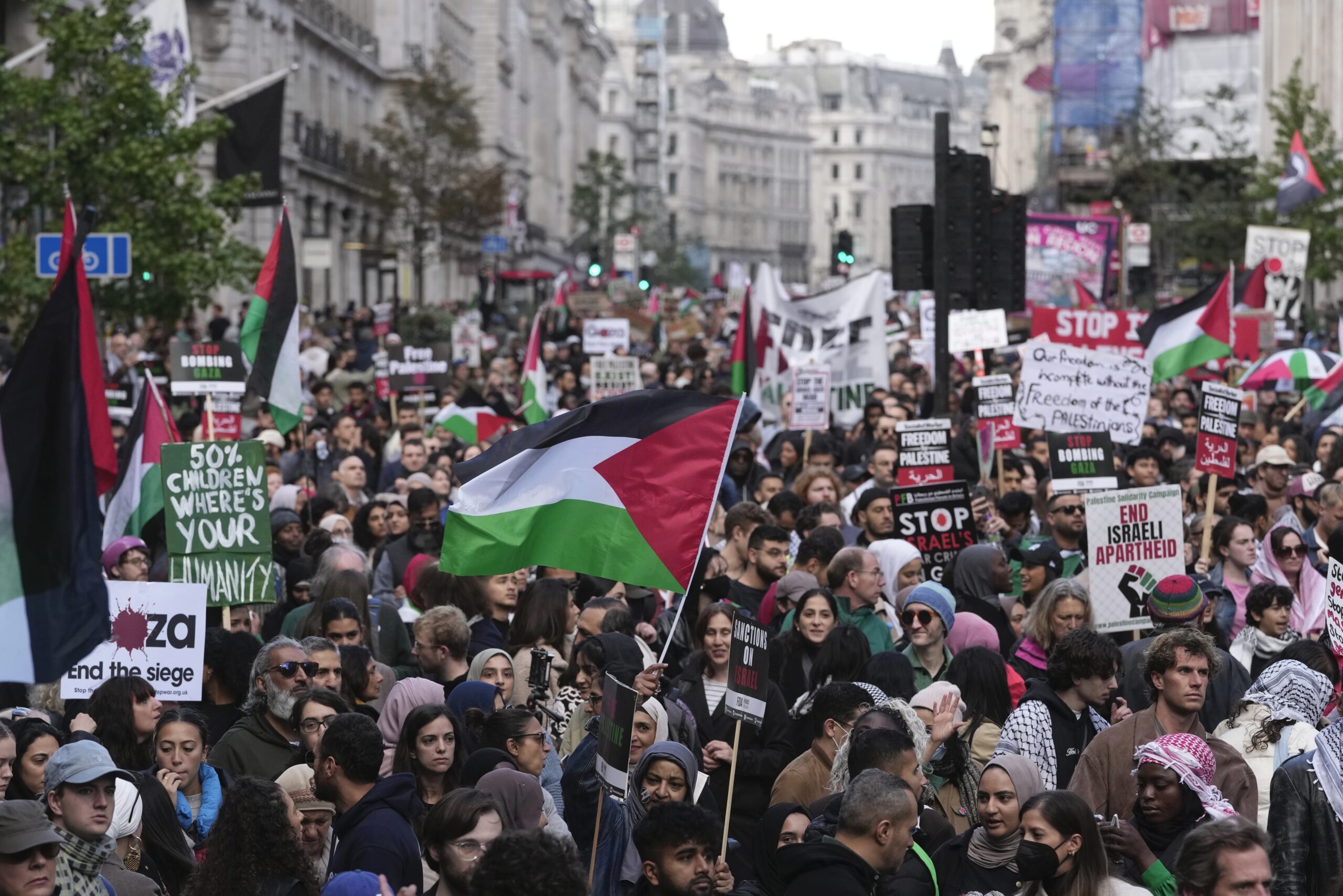 UK threatens arrests for Hamas supporters as thousands of pro-Palestine protesters flood streets