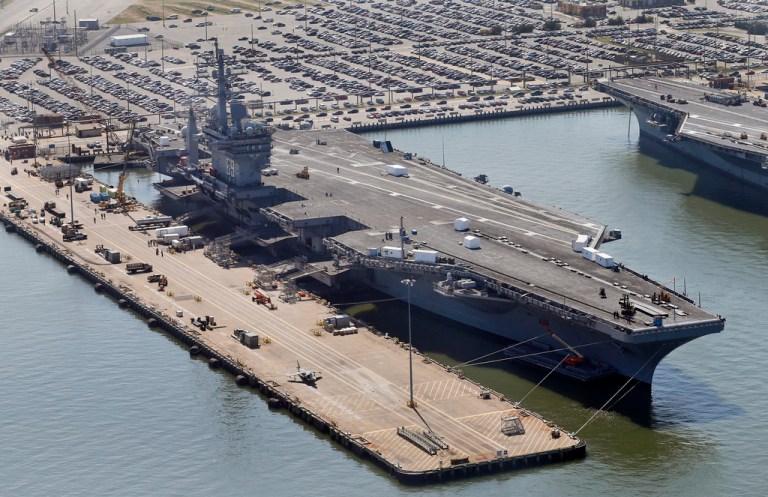 The nuclear powered aircraft carrier USS Dwight D. Eisenhower sits pier side at Naval Station Norfolk in Norfolk, Va., Wednesday, April 27, 2016.