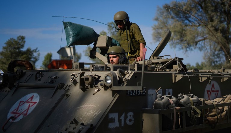 Israeli soldiers gather in a staging area near the border with Gaza Strip, in southern Israel Tuesday, Oct. 17, 2023.