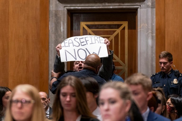 A protester is removed from a Senate Foreign Relations Committee hearing by Capitol Police on Wednesday, Oct. 18, 2023, in Washington.