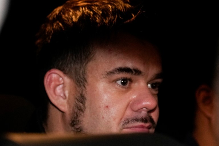 FILE - Dutch citizen Joran van der Sloot is driven in a police vehicle from a maximum-security prison to an airport to be extradited to the U.S., on the outskirts of Lima, Peru, Thursday, June 8, 2023.