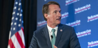 FILE - Republican Virginia Gov. Glenn Youngkin speaks to David Rubenstein during an interview hosted by the Economic Club of Washington, Sept. 26, 2023, in Washington. (AP Photo/Stephanie Scarbrough, File)