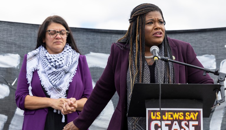 Rep. Cori Bush (D-MO) speaks as Rep. Rashida Tlaib (D-MI) listens during a demonstration calling for a ceasefire in Gaza near the Capitol in Washington on Wednesday, Oct. 18, 2023.