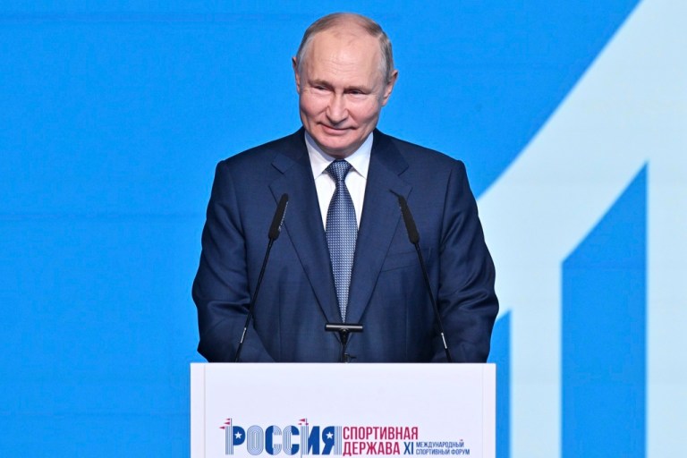 Russian President Vladimir Putin smiles as he delivers his speech during a plenary session of the Russia - Country of Sports International Sports Forum in Perm, Russia, Thursday, Oct. 19, 2023.