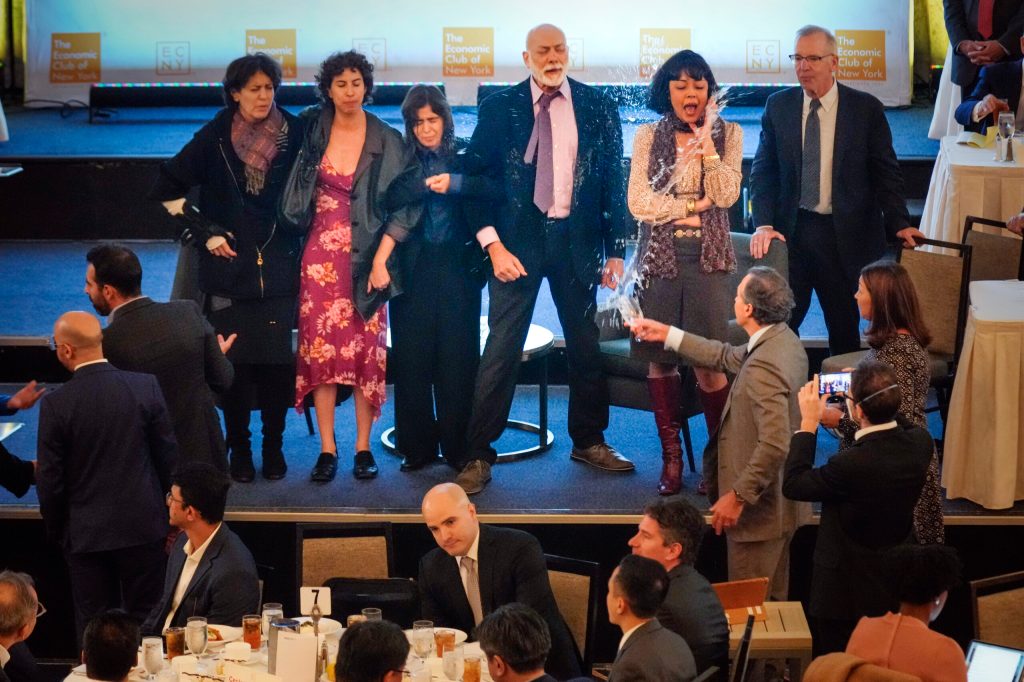 Climate protesters interrupt major speech by Fed Chairman Jerome Powell