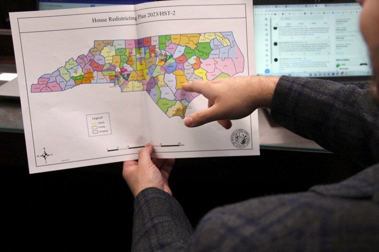 The North Carolina state House reviews copies of a map proposal for new state House districts during a committee hearing at the Legislative Office Building in Raleigh, N.C., Thursday, Oct. 19, 2023.