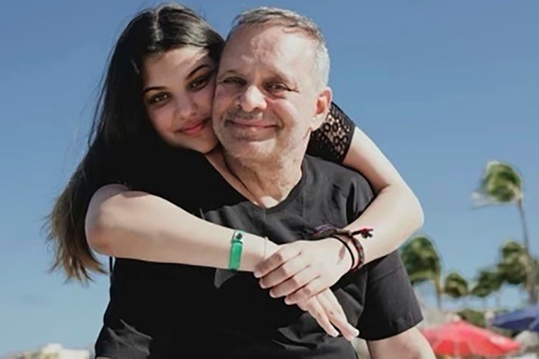 This photo provided by the Raanan family shows Natalie Raanan and her father, Uri Raanan, in Mexico.  